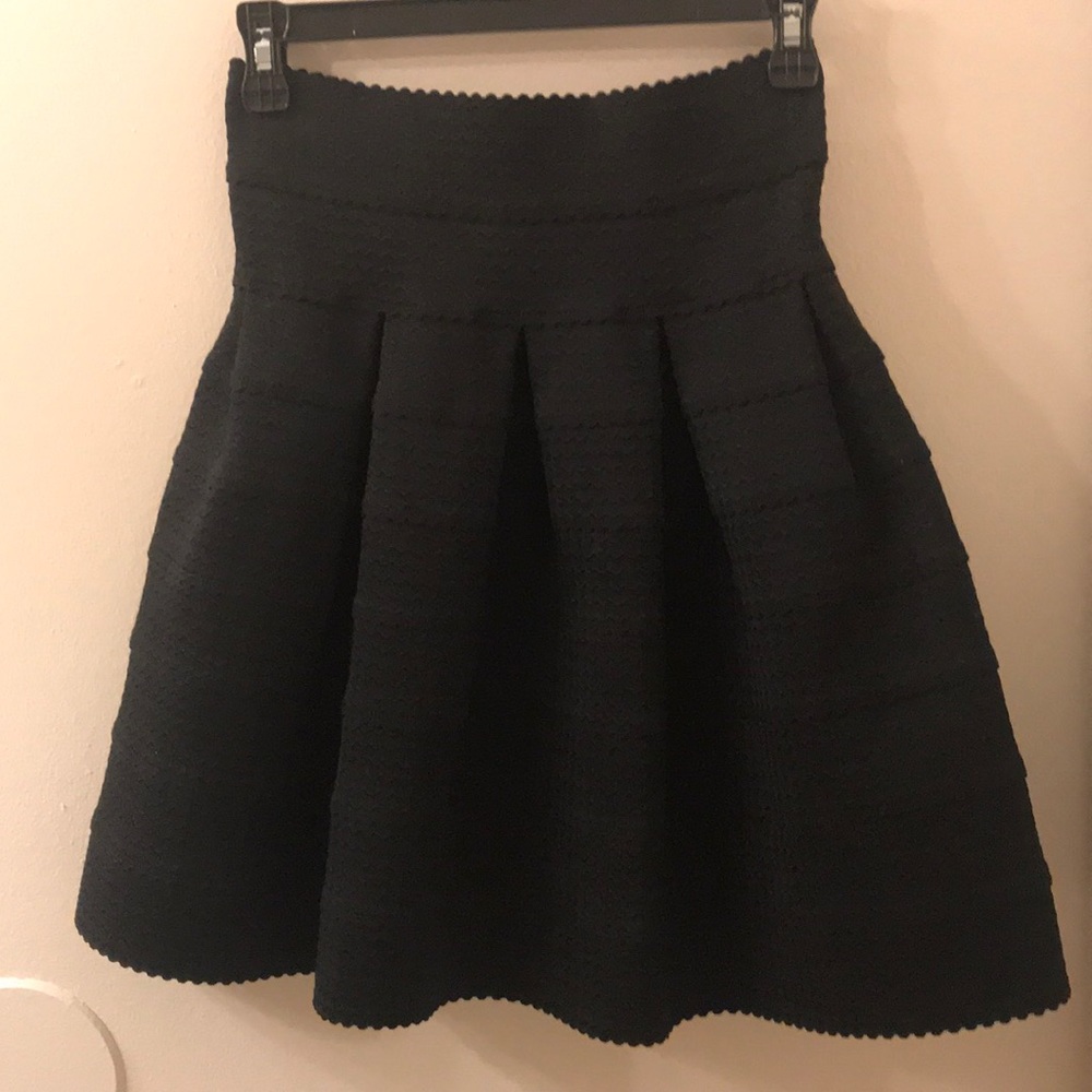 Black high waisted skirt.